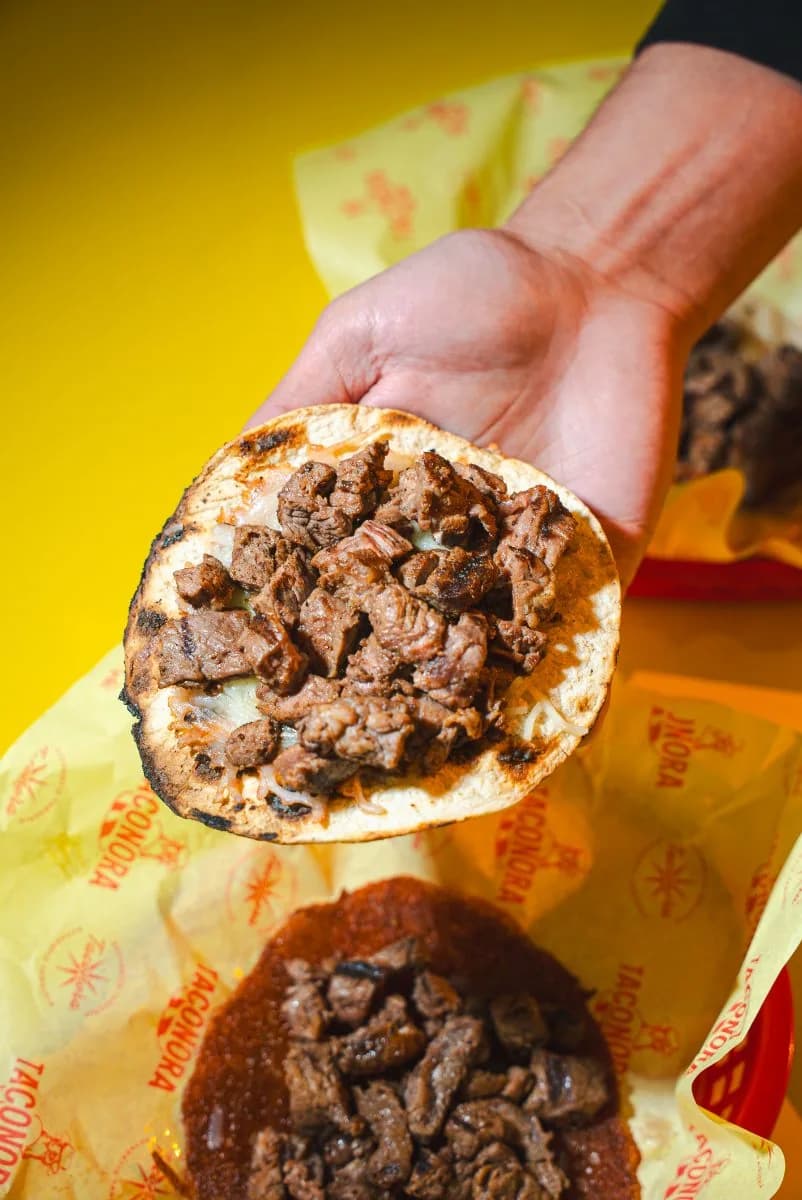Grilled prime steak taco on Taconora wax paper